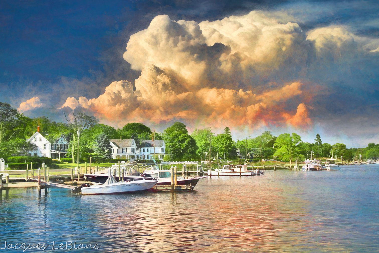 Clouds from a building summer storm are the backdrop for this Lake Avenue landscape in Center Moriches, New York.